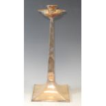 A large silver plated Arts and Crafts style candlestick, everted cylindrical sconce, hemispherical