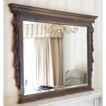 A contemporary overmantel mirror, moulded cornice, carved drapes to sides, 108cm x 94cm
