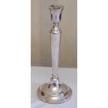 A silver table candlestick, bell shaped sconce, tapering cylindrical column, 30cm high, David Shaw