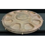 An enormous E.P.N.S. lazy Susan, wiith ten bowl apertures, button handles, 93cm diam