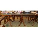 A 20th century walnut three pedestal dining table, rounded top, 210cm long, two leaves 46cm each,