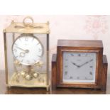 A 1930 oak mantel clock, Sterling Electric; a Kundo brass perpetual clock (2)