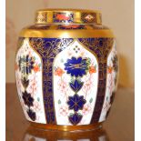 A Royal Crown Derby 1128 ginger jar and cover, 11.5cm high, printed marks (first quality)