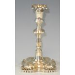 An Edwardian silver taper stick, in George II style, detachable nozzle, knopped column, shaped