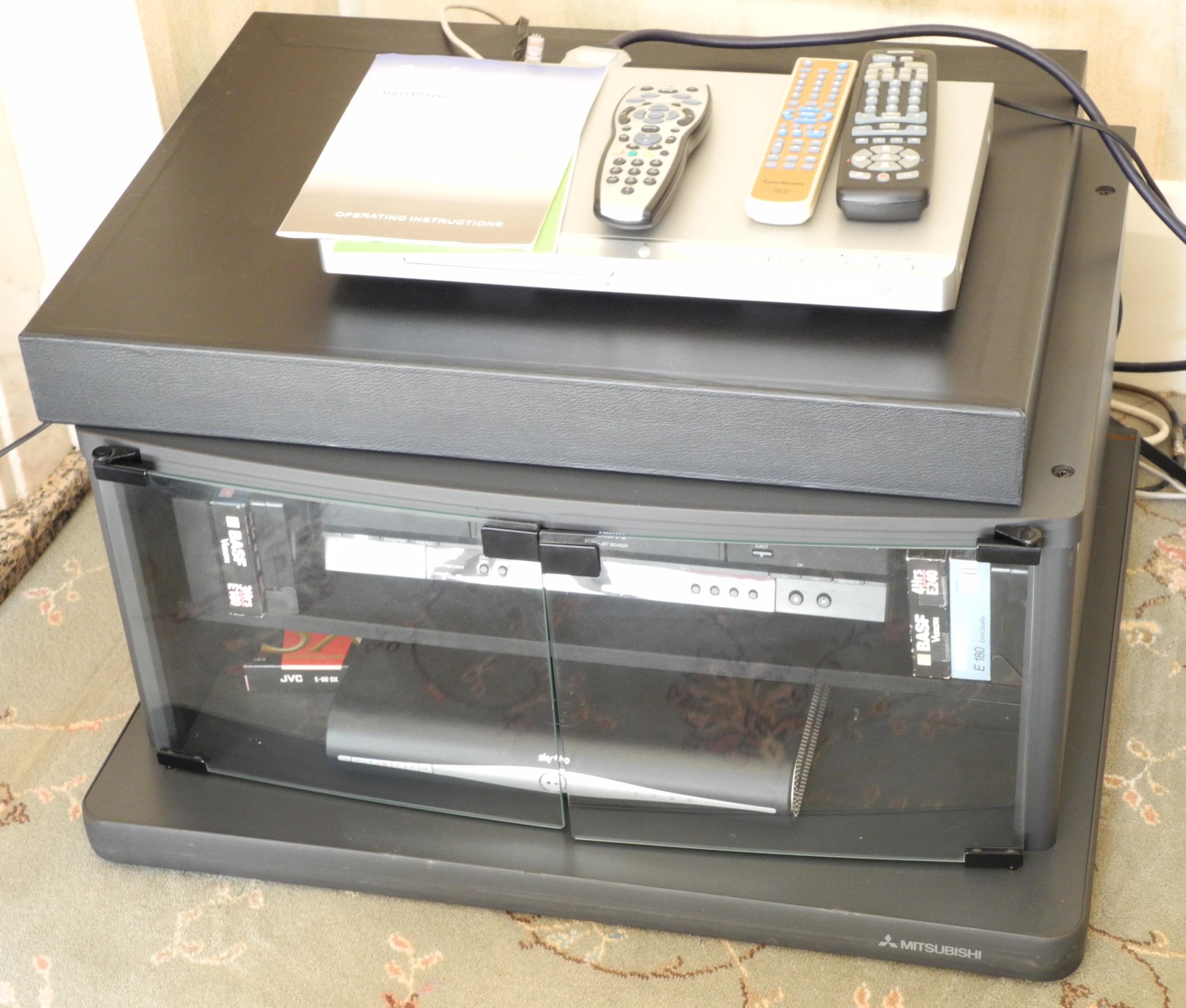 A Panasonic Super Drive video recorder; a Sky+HD Box; Goodmans DVD 2200 DVD CD player; a