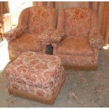 A pair of early 20th century arm chairs, with slightly winged backs, c.1930