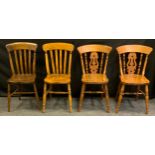 A pair of country house beech and elm kitchen side chairs, saddle seats, H-stretchers; another