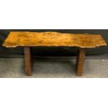 A 20th century Nigel/Rupert Griffiths pollard oak coffee table, 46cm high, 122cm wide, 42cm deep.