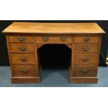 An early 20th century mahogany knee-hole desk, moulded rectangular top above a long central drawer