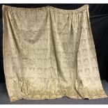 A gold Velvet textured curtain, 196cm drop, 256cm wide.