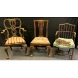 A George III mahogany open arm chair, out swept arms, H-stretcher; a Irish Chippendale mahogany open