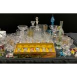 A Victorian shaped clear glass decanter, blown stopper; another later; assorted stemware, vases,
