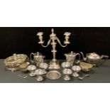 A silver plated two branch candelabra; three piece tea set, set of six champagne bowls etc.