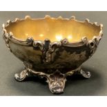 A Victorian silver sugar bowl, cast rim, engraved floral collar, shaped scroll feet, George Angell &