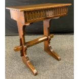 A 20th century Nigel/Rupert Griffiths style oak Childs desk/lectern, rectangular top above a short