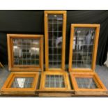 Six leaded clear glass windows, oak frames, five opening, one fixed, different sizes and shapes,