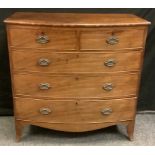 A Victorian mahogany bow-front chest of drawers, two short cockbeaded drawers above three long