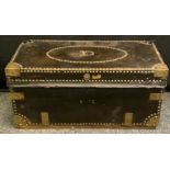 An 18th century brass bound leather travelling trunk, hinged cover, studded borders, swan neck