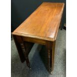 A late Victorian mahogany drop-leaf table, rounded rectangular top, turned legs.