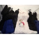 A collection of Under garments to include slips and baby doll negligée and a packet of Modesty