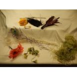 A collection of vintage (1930's) hair accessories, feathers , decorations for hats etc.. includes