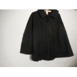 A Victorian? black cape with beading work hook and eye fastening some discolouration due to age/