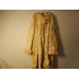 A vintage 1970's ? Sheep skin/fleece coat very heavy, with hood. No makers label