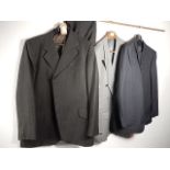 A collection of trouser suits - 1 grey the rest pinstripe