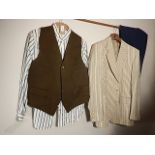 A collarless shirt and waistcoat, and a striped jacket and navy trousers