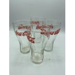 four vintage Coca-Cola glasses