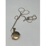 silver chain with round locket