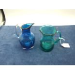 2 Small Glass Jugs 4 and 5 inches tall