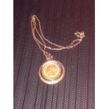 Sovereign in yellow metal pendant mount with 9ct chain