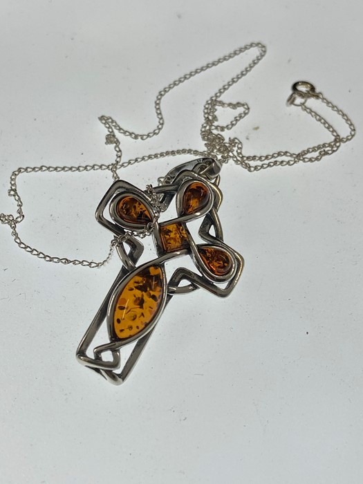 One amber and sterling silver pendant Celtic cross necklace