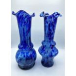 A pair of blue glass vases, 30cm tall