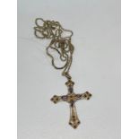 silver necklace with jewelled crucifix