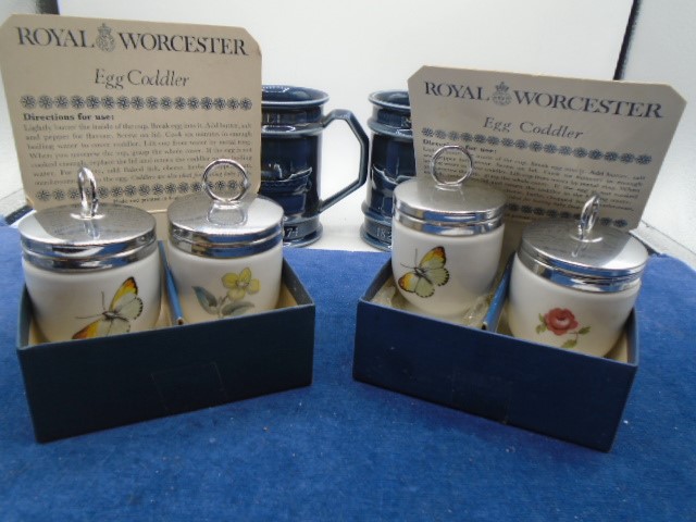 2 x RNLI mugs made by Holkham pottery and 2 boxed sets of Royal Worcester egg coddlers, all in