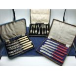 2 Cased Sets of Butter Knives and Cased set of Cake Forks