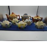 lot of cottage ware teapots and some in similar style