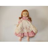 A Madame Alexander "American Girl" doll 8 inches high, 1950's - marked 'Alex' on the back with sleep