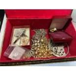 A gilted jewellery box with contents of costume jewellery