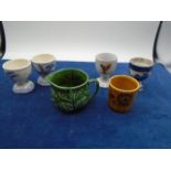 collection of egg cups to include 1 Palissy, 2 delft and green sylvac jug