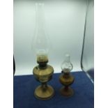 2 Oil Lamps ( glass cracked on largest one)