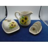 lovely sunflower breakfast set consisting of butter dish, jug and toast rack.