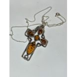 One amber and sterling silver pendant Celtic cross necklace