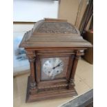 Mahogany cased clock with pendulum 19 inches tall