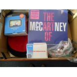A box of various items to include a sealed - 'The art of McCartney ' vinyl album, a Garmin sat-