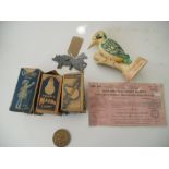 A collection of items - Metal pig and horse flats, Olympic medallion, 3 boxed 1930-40's light bulbs,
