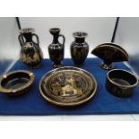 collection of greek china, black with gold detail.