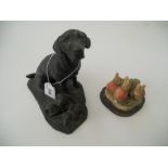 A figure of a Labrador and three puppies by Heredities and a Border fine arts 100th (1893 -1993)